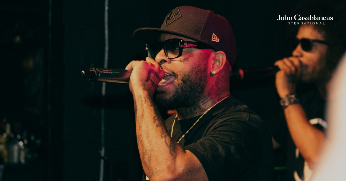 two singers performing on a stage