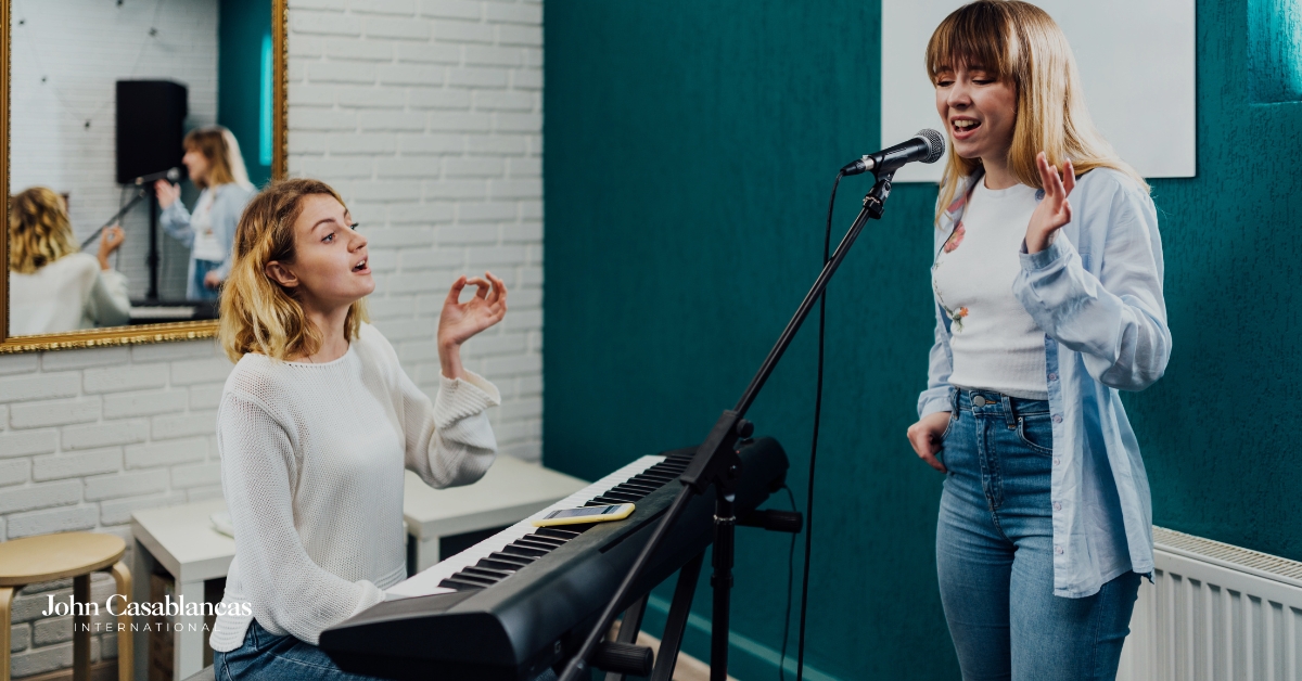 a vocal coach and a student during a lesson