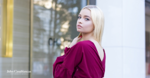 blonde model in a pink shirt posing